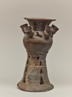Footed Jar with Smaller Jars and Figural Ornaments