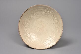 Dish with Flying Phoenixes and Vines, Stamped white porcelain