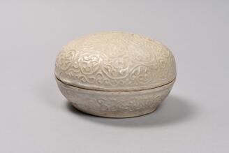 Covered Box, White porcelain with stamped arabesque design