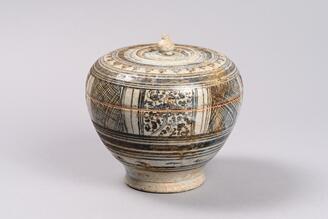 Arabesque design in underglaze brown on white slip